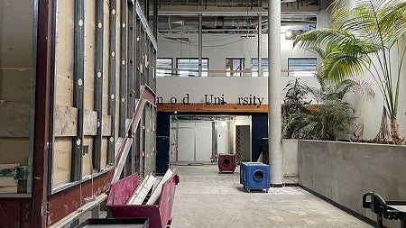 During renovation of the UO Portland Campus Center. This photo shows the main entry of the building. Finishes have been removed in preparation to remove a wall on the left. 